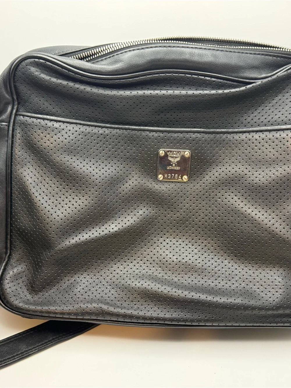 MCM Black Perforated Leather Messenger Bag with Gold Plaque
